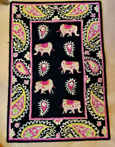 Rug, elephants and paisley swirls scatter